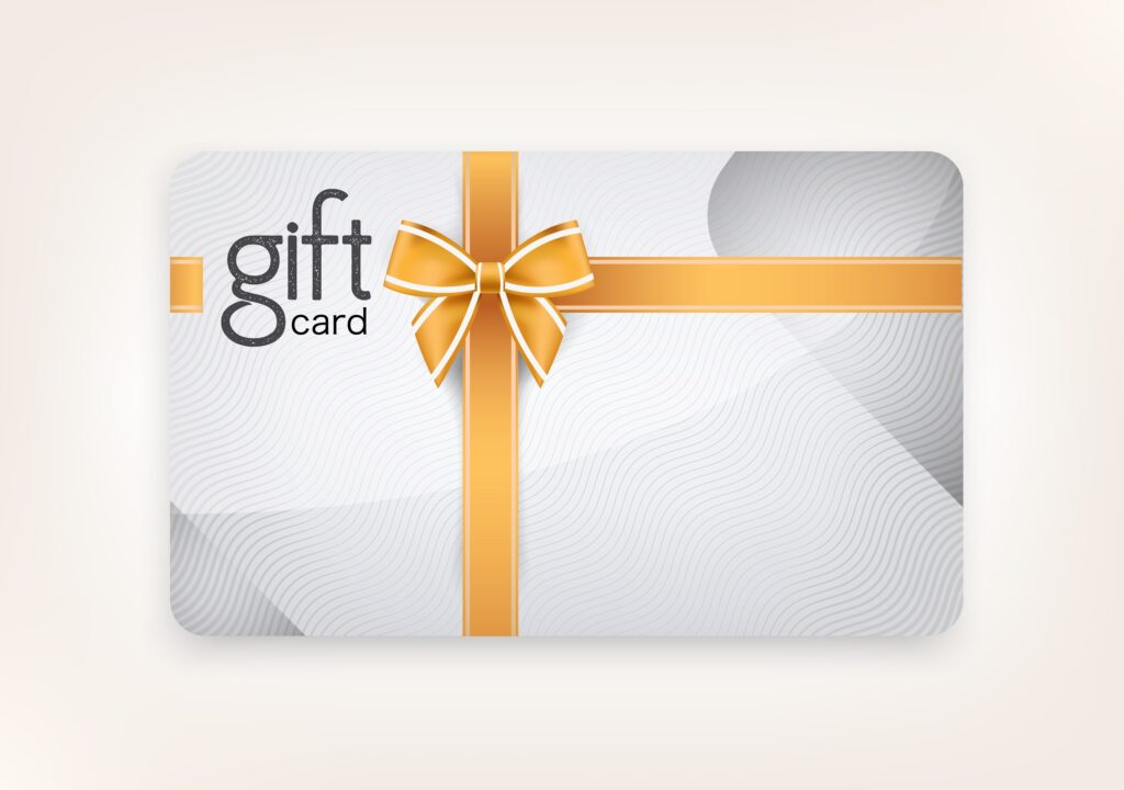 Vector gift card decorated in a gold ribbon with the words gift card in the upper left corner.