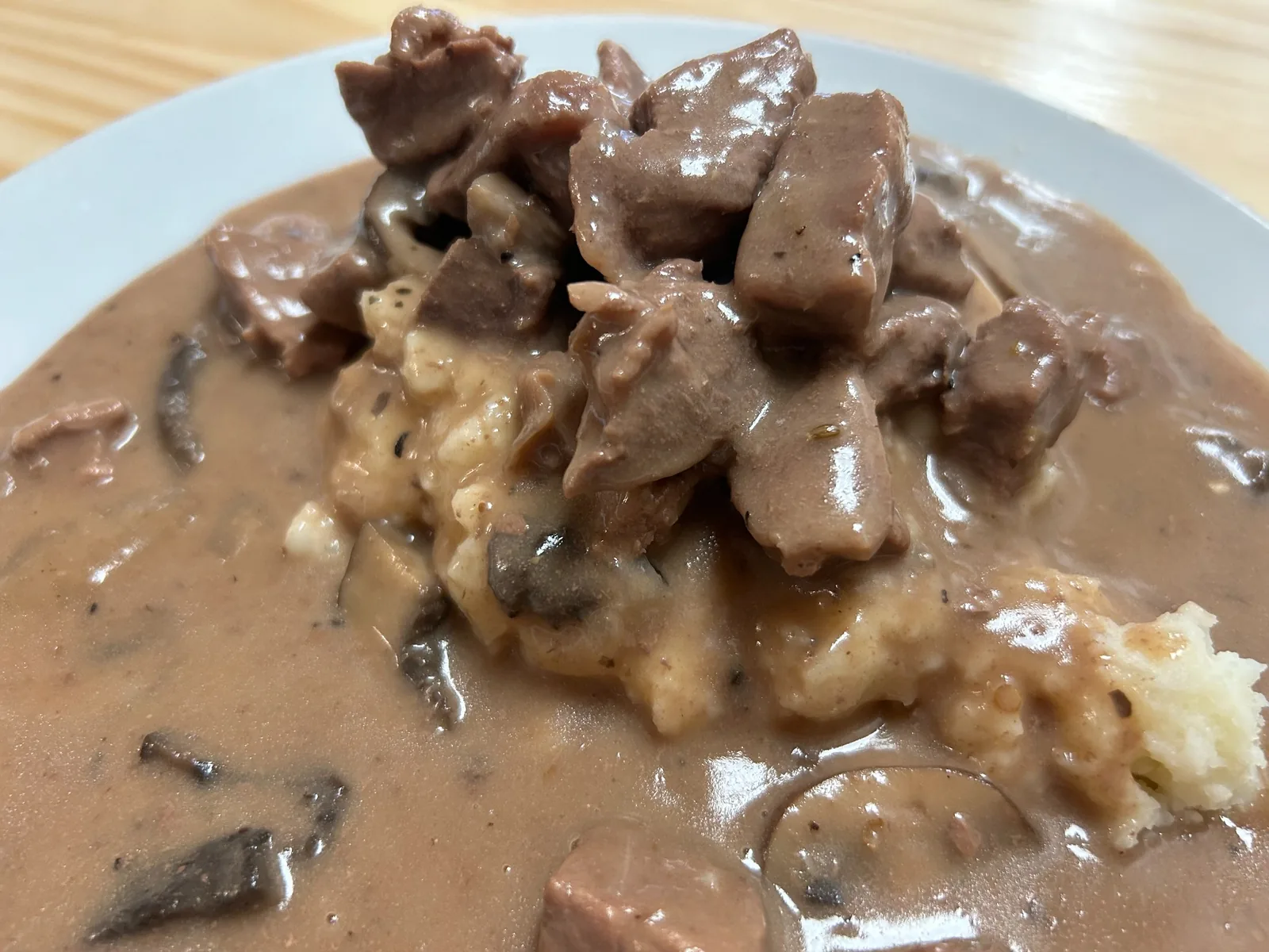 Close-up of beef stroganoff with mushrooms and rich gravy served over mashed potatoes at Kat’s Café & Restaurant.