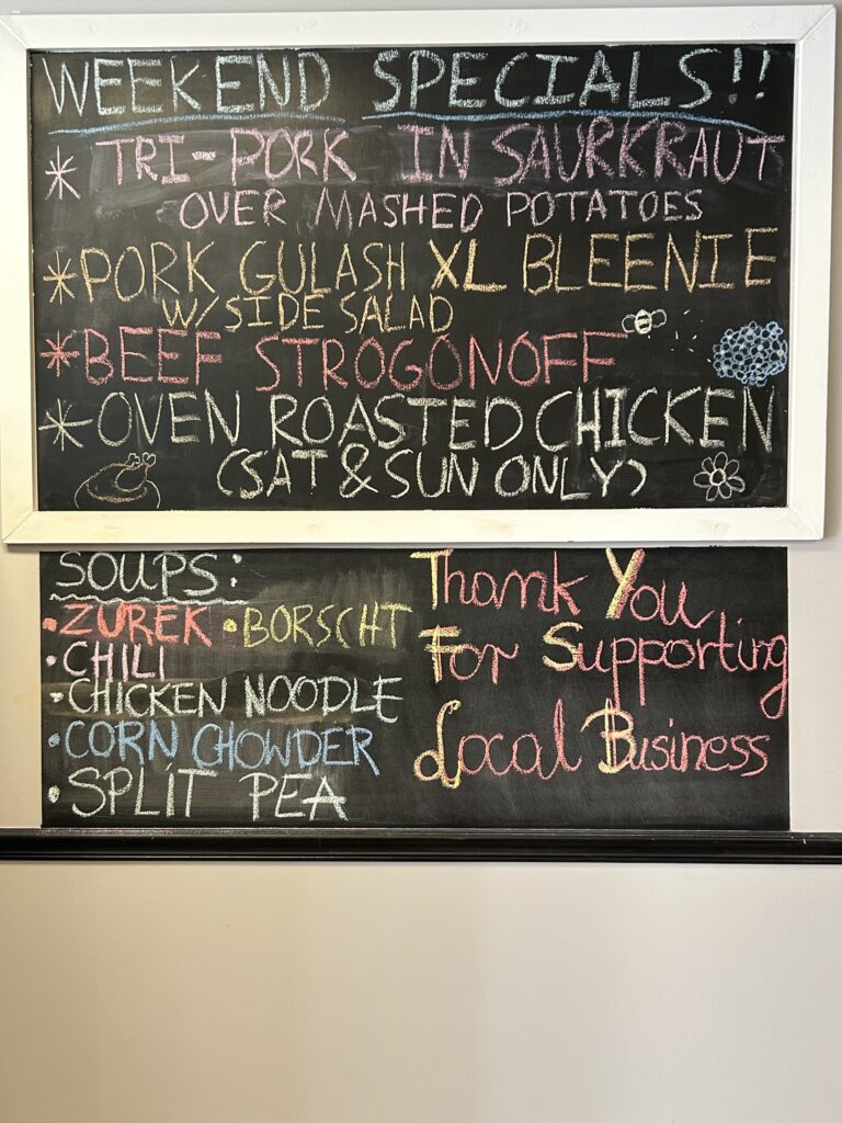 Check the Chalkboard at Kat's Cafe & Restaurant in Minersville showing the specials for the 2nd weekend of June: tri-pork sauerkraut, roasted chicken, beef strogonoff, roasted chicken, and soups such as zurek, borscht, chicken noodle, corn chowder, split pea.