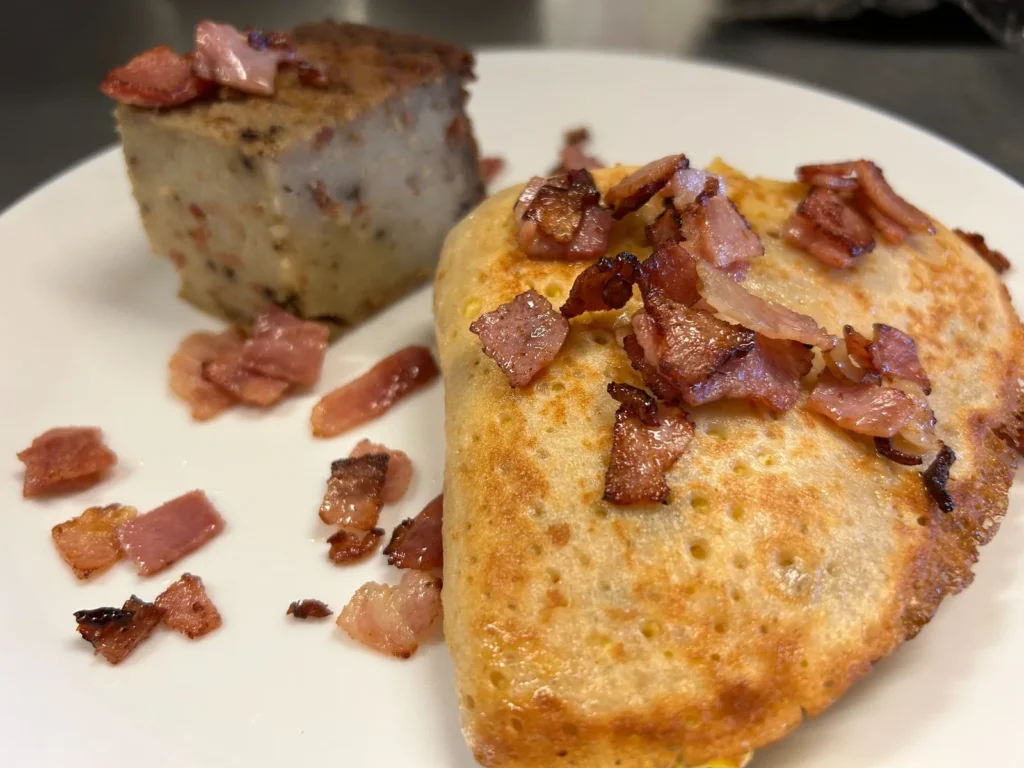 Ham, egg, and cheese breakfast crepe served with a savory potato babka side at Kat’s Café & Restaurant.