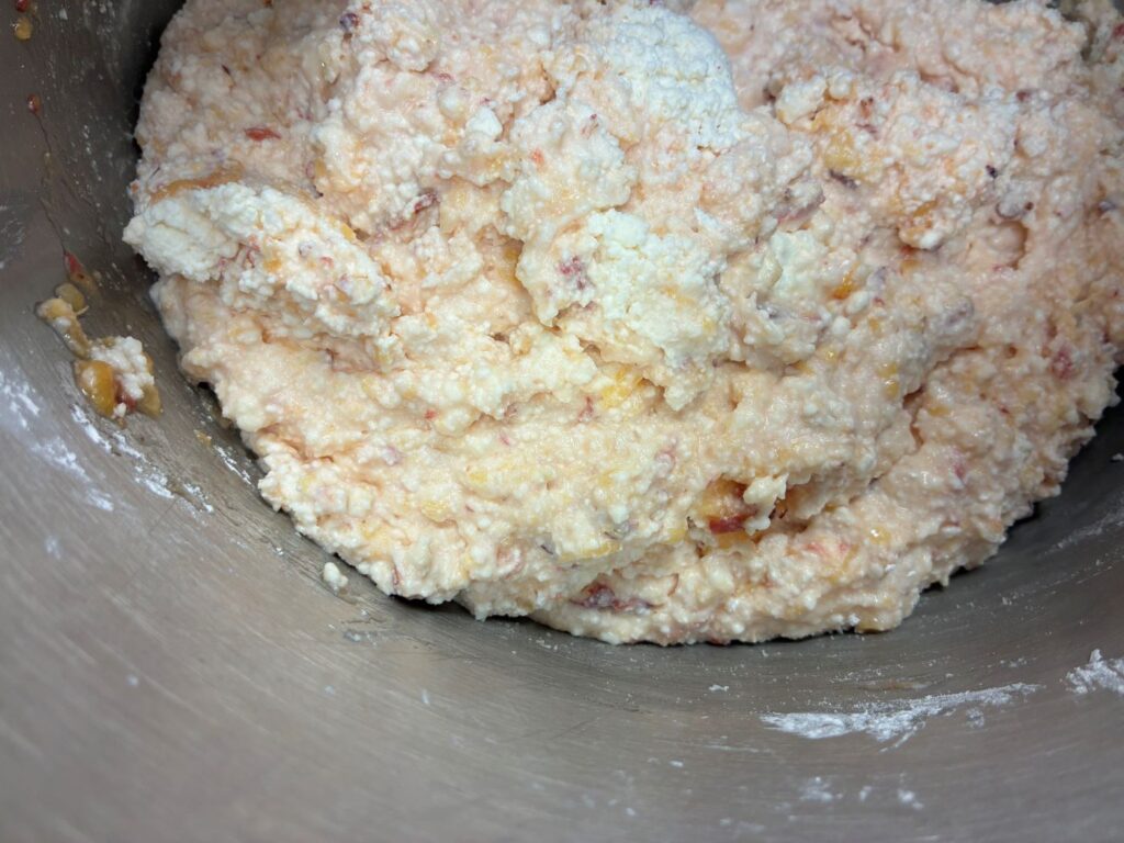 Kat's Peach Pierogi Filling with the Fresh Peaches Mixed into the Farmer's Cheese in a Commercial Grade Stainless-Steel Mixing Bowl.