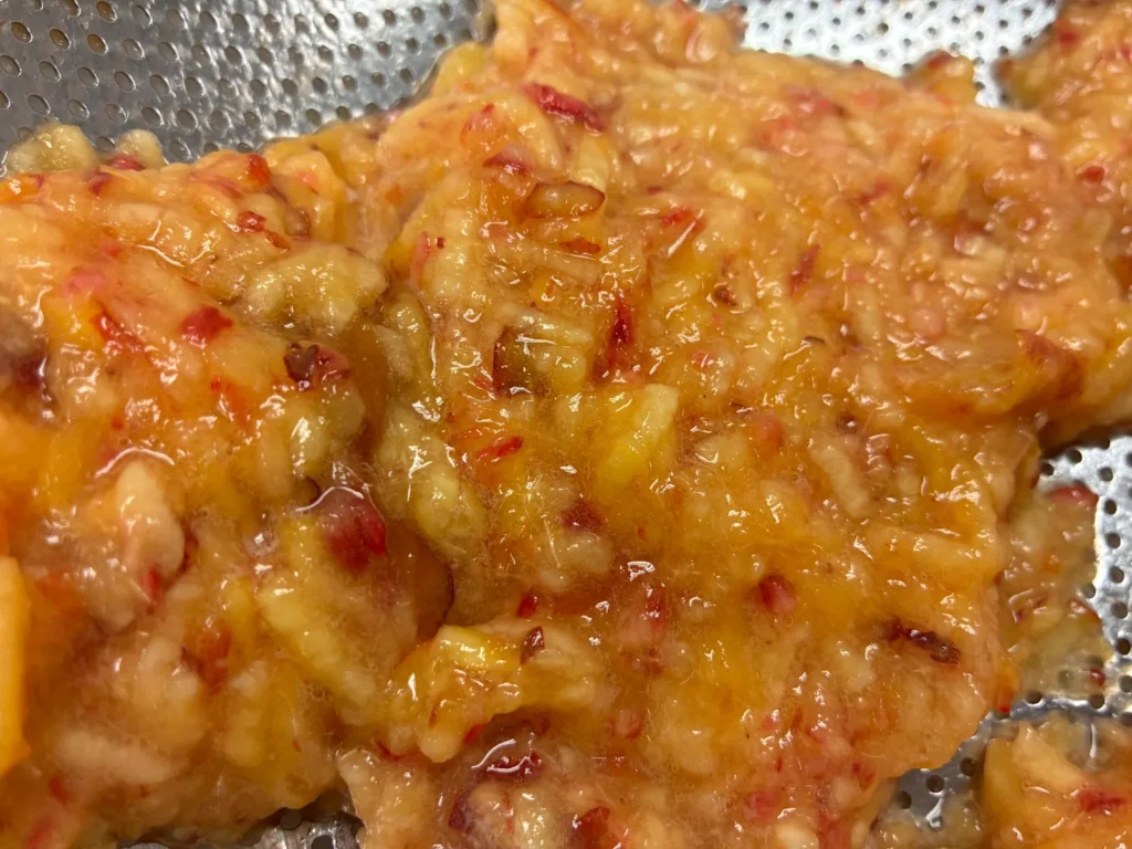 Close-up of fresh peach filling prepared for seasonal peach pierogies at Kat’s Café & Restaurant.