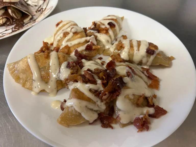 Bacon chicken ranch pierogies topped with crisp bacon and creamy ranch sauce at Kat’s Café & Restaurant.