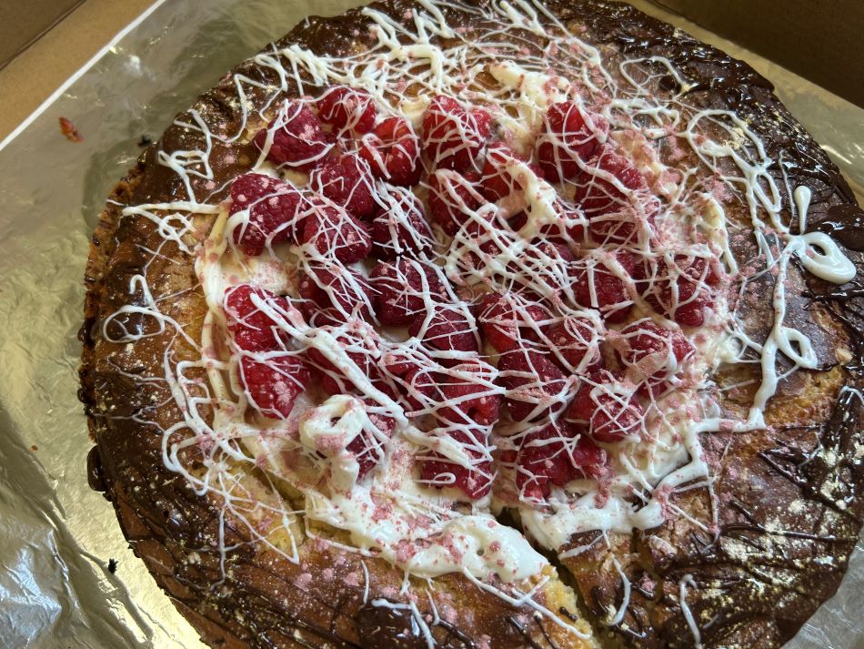 Raspberry Chocolate Vanilla Cake in an open box.