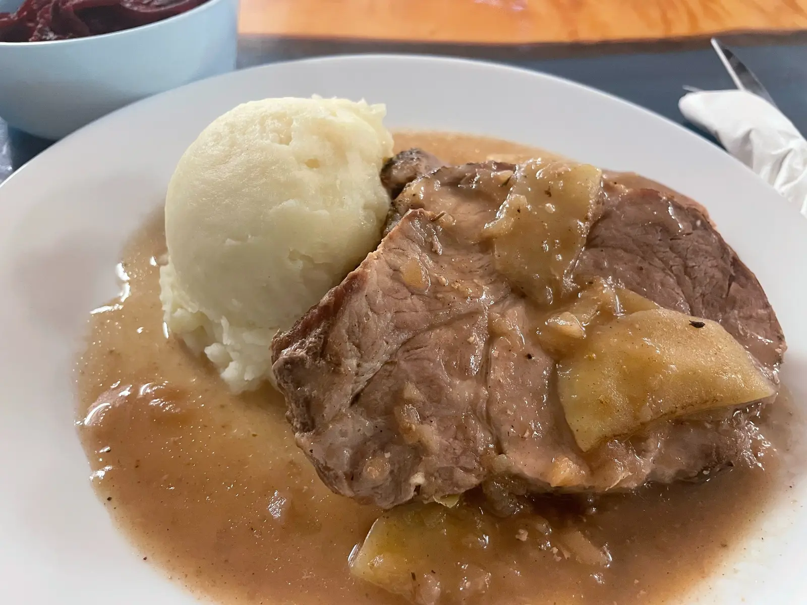 Slices of apple pork roast topped with light apple gravy and served with homemade mashed potatoes at Kat’s Café & Restaurant.