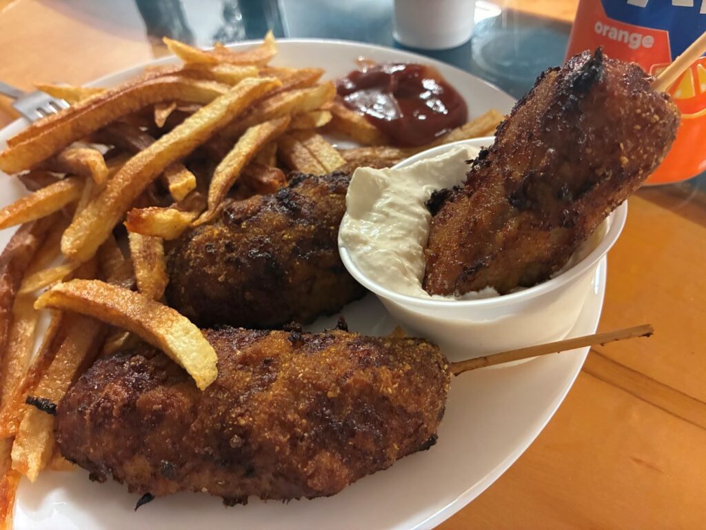 Kat's City Chicken in the Dip Sauce on a Plate with Fries and More City Chicken on the Plate with a Can of Orange Soda.