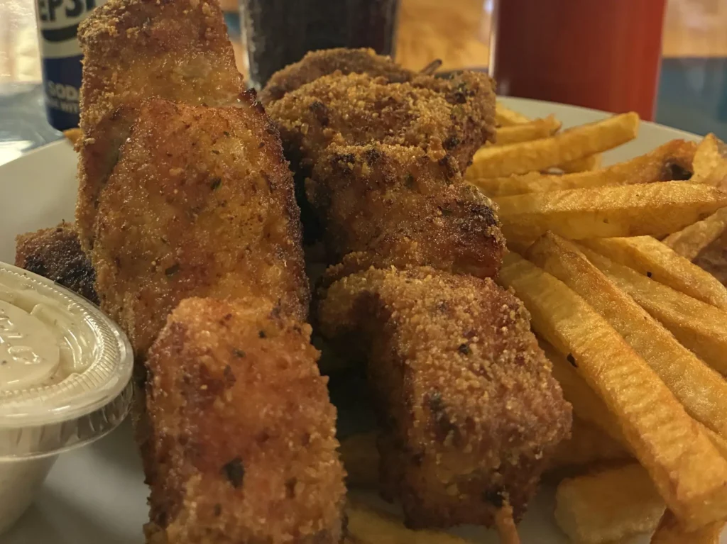 Lightly breaded chunk-style City Chicken skewers served with fresh-cut fries and dipping sauce at Kat’s Café & Restaurant.