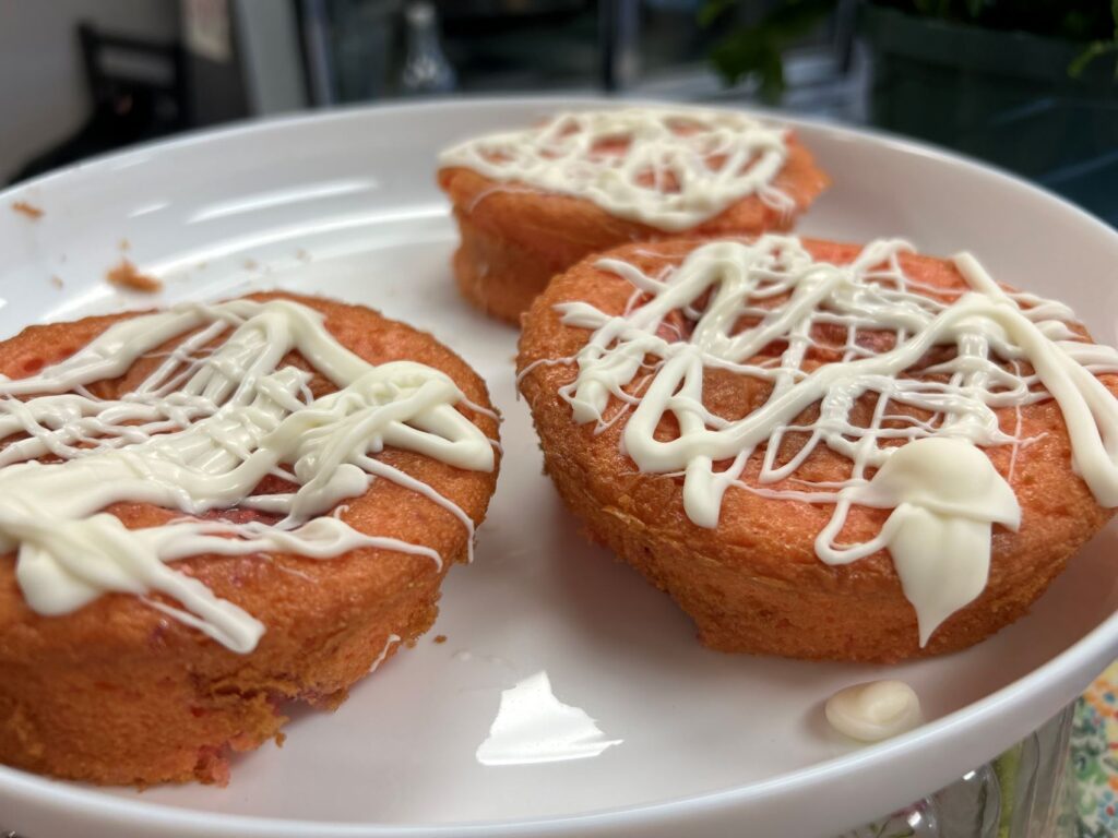 Strawberry Banana Mini Cakes with Real Frosting served on a white plate.