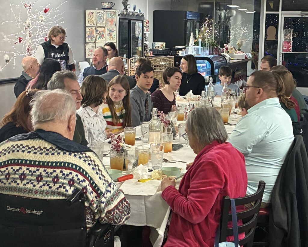 Kat's 2nd Annual Christmas Eve Holy Supper at 630pm Photo of Happy Guests at the Table Enjoying Great Food, Memories, and Conversation.