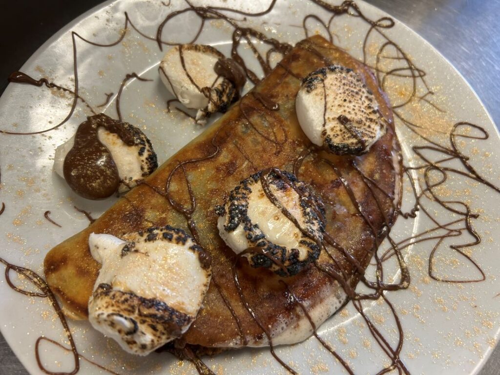 A photo of a top perspective of Kat's Nutella S'mores Crepe.