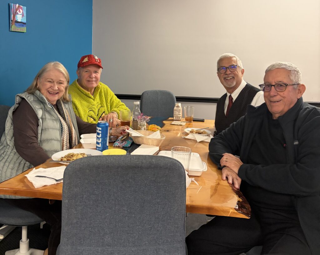 A photo of a group of elderly friends enjoying a wholesome meal at Kat's.