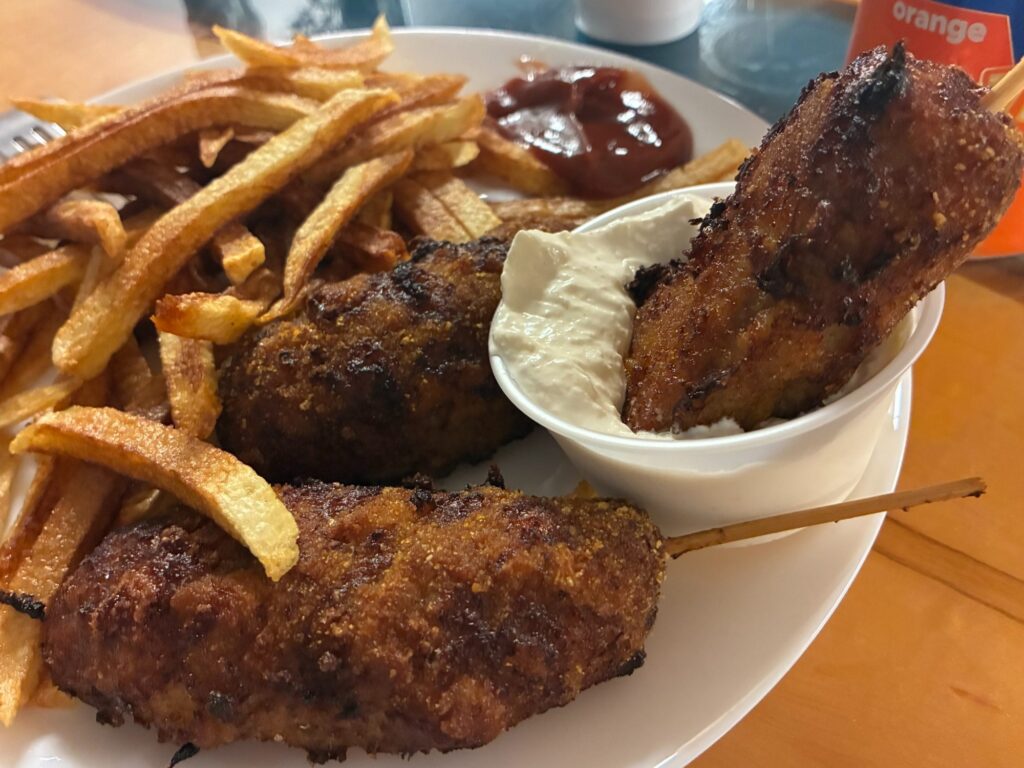 City chicken served with fries and dipping sauce at Kat’s Café & Restaurant.