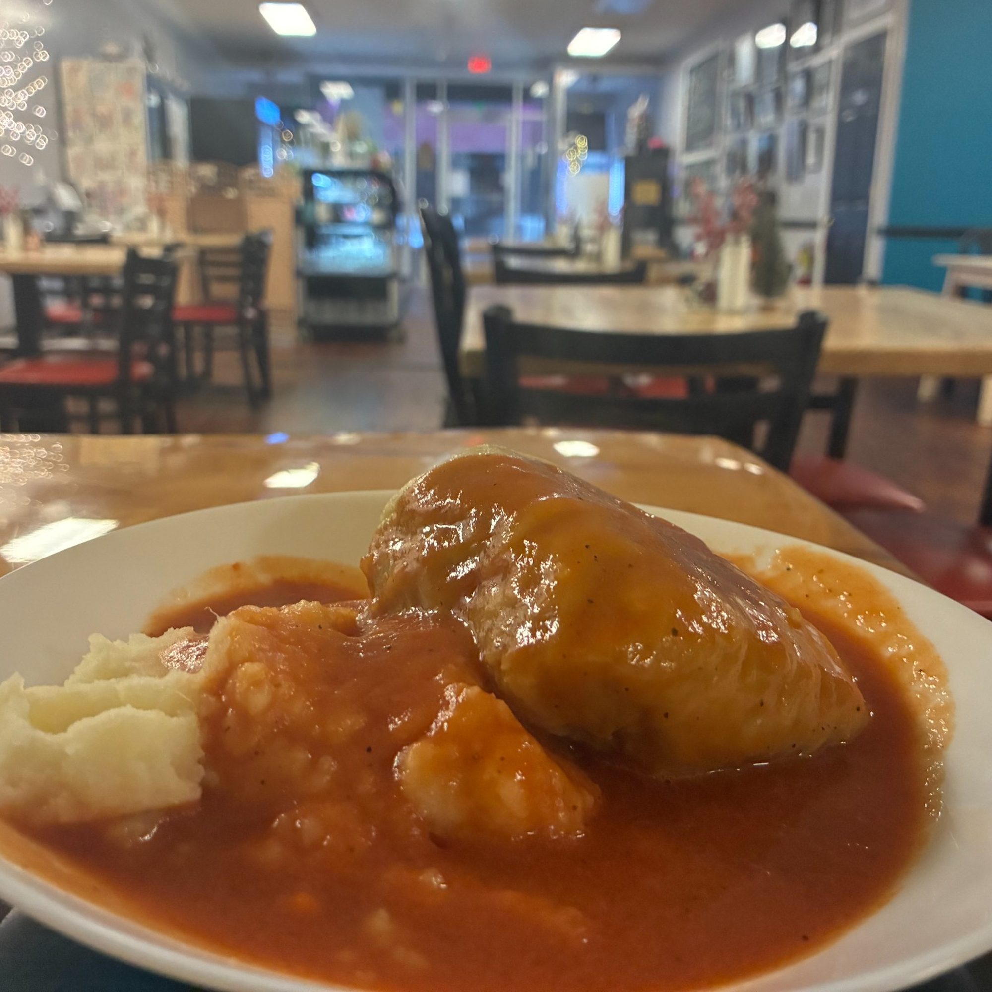 Comfortable dining room at Kat’s Café & Restaurant with a lunch plate served at the table near Pottsville, PA.