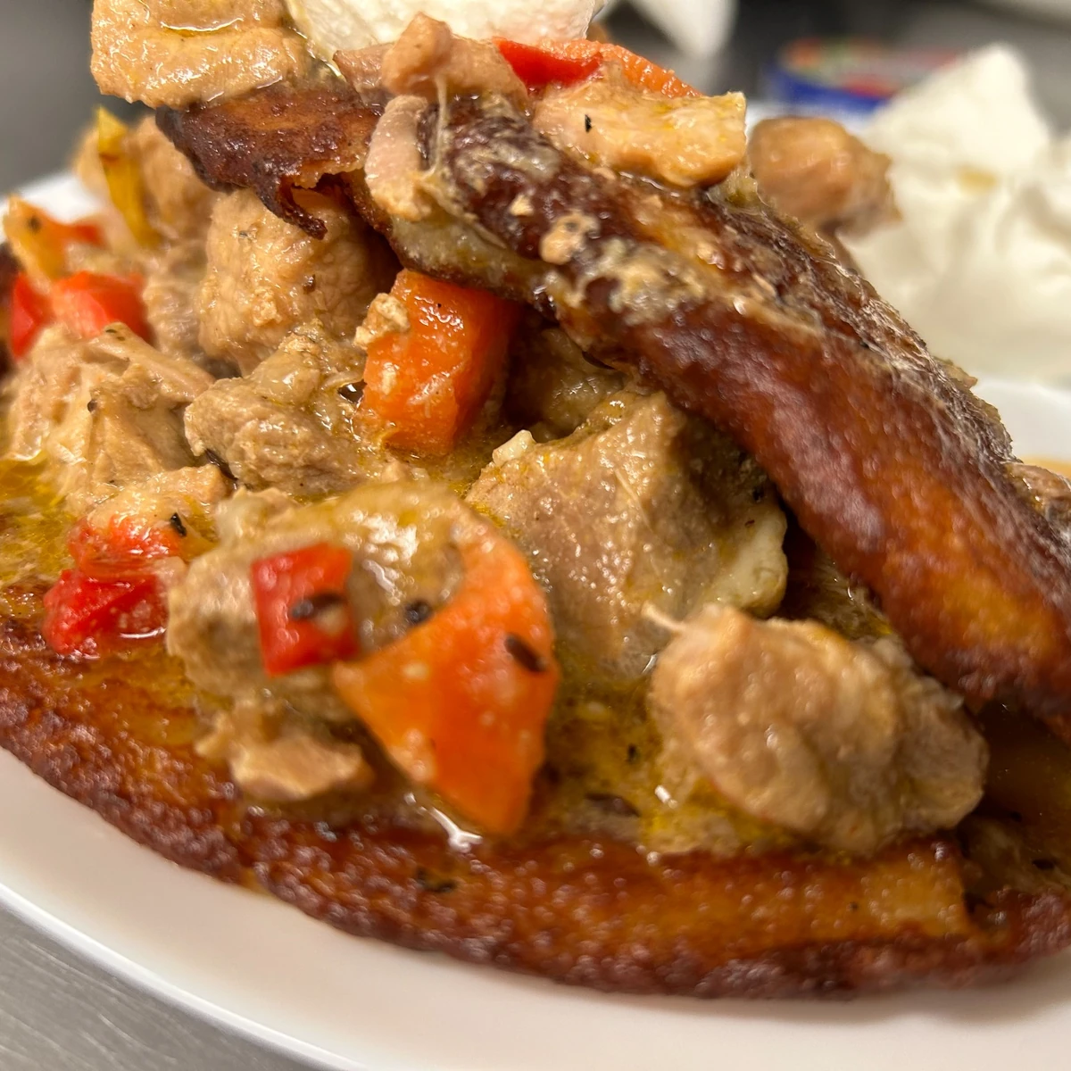 Hearty goulash stuffed in an XL crispy blini topped with more goulash and a dollop of sour cream, served with a daily Slavic veggie salad. Also known as "Placek po Węgiersku."