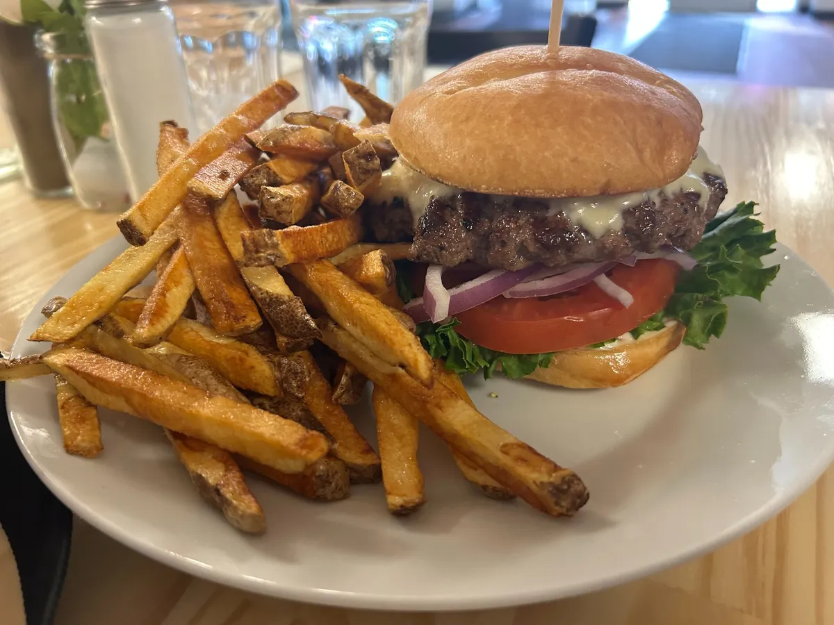 Fresh smash burger with melted cheese, lettuce, tomato and red onion served with hand-cut fries.