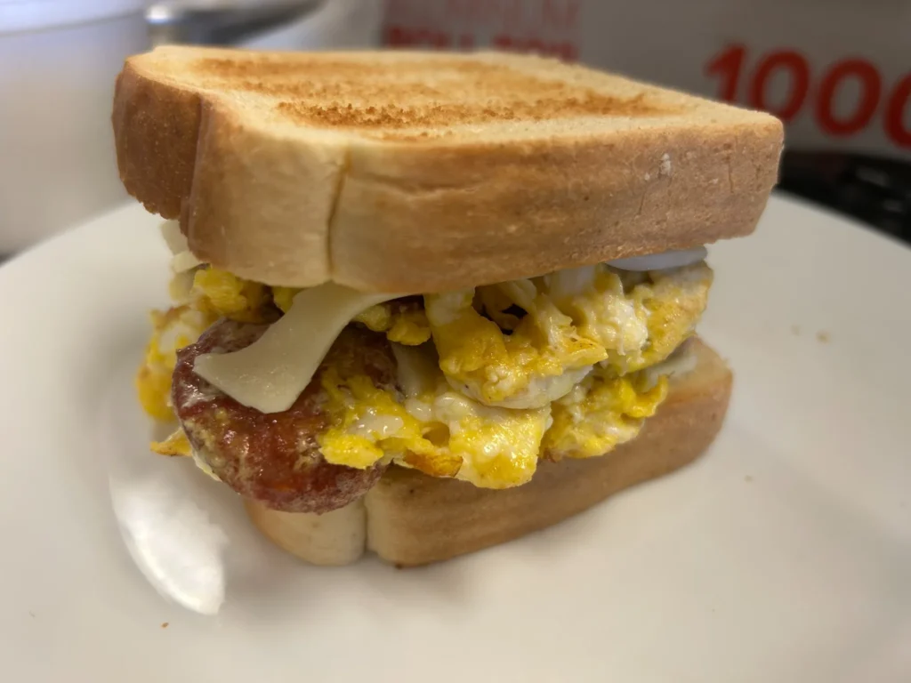 Kielbasa, egg and cheese sandwich on toasted Texas toast.