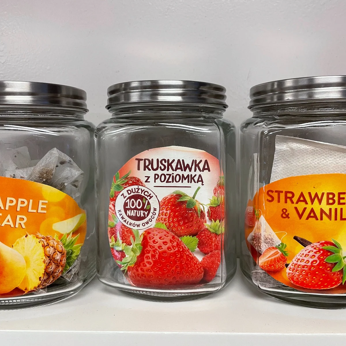 Close-up of fruit and herbal tea flavors, including pineapple pear, wild strawberry, and strawberry vanilla, at Kat's Café & Restaurant.