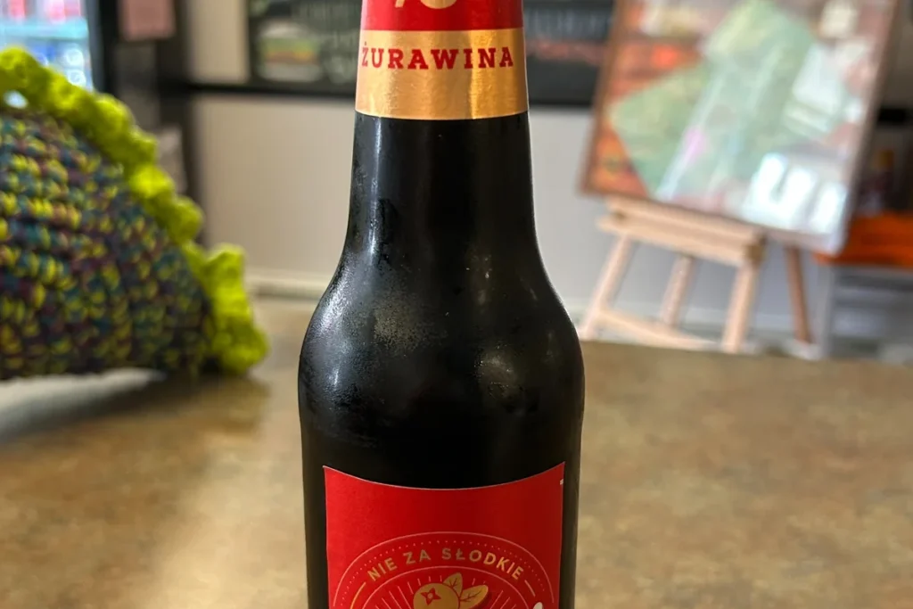 Bottle of Karmi Żurawina 0.0 non-alcoholic malt beverage at Kat's Café & Restaurant.