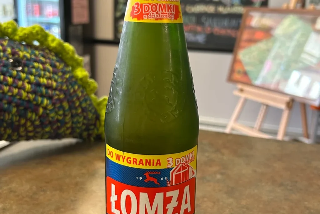 Bottle of Łomża 0.0 non-alcoholic beer at Kat's Café & Restaurant.