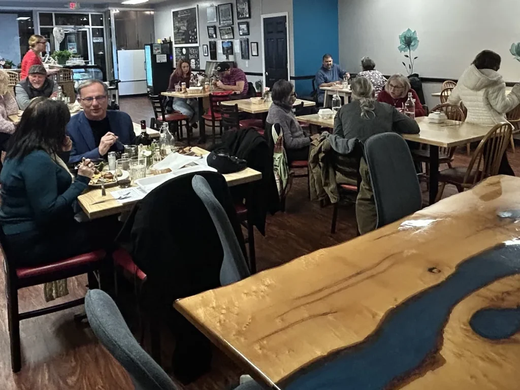 Guests eating throughout the dining room at Kat’s Café & Restaurant.