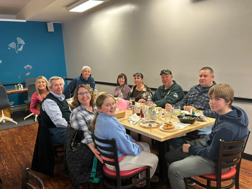 Guests of all ages seated together for a family meal at Kat’s Café & Restaurant.