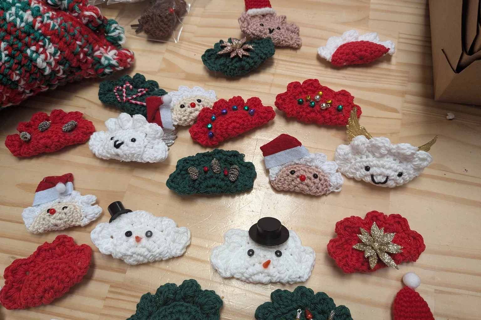 Assorted handmade Christmas crochet ornaments displayed across a tabletop at Kat’s Café & Restaurant.