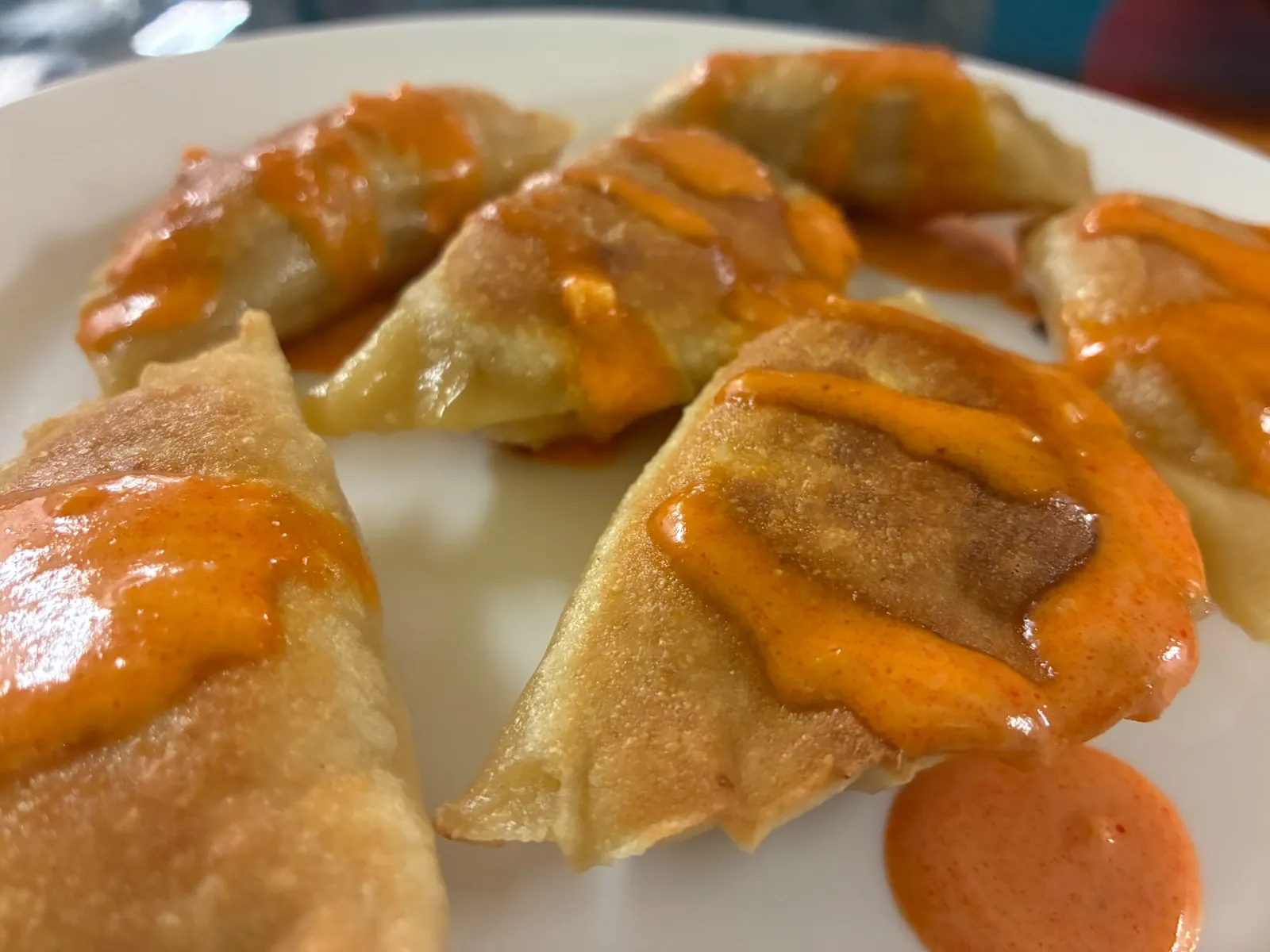 Buffalo chicken pierogies drizzled with orange in-house buffalo sauce at Kat’s Café & Restaurant.