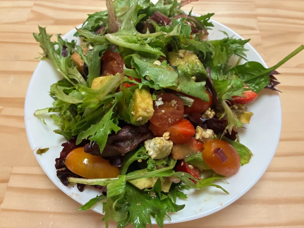 Mixed green salad with avocado, strawberries, cherry tomatoes, and feta cheese at Kat’s Café & Restaurant.