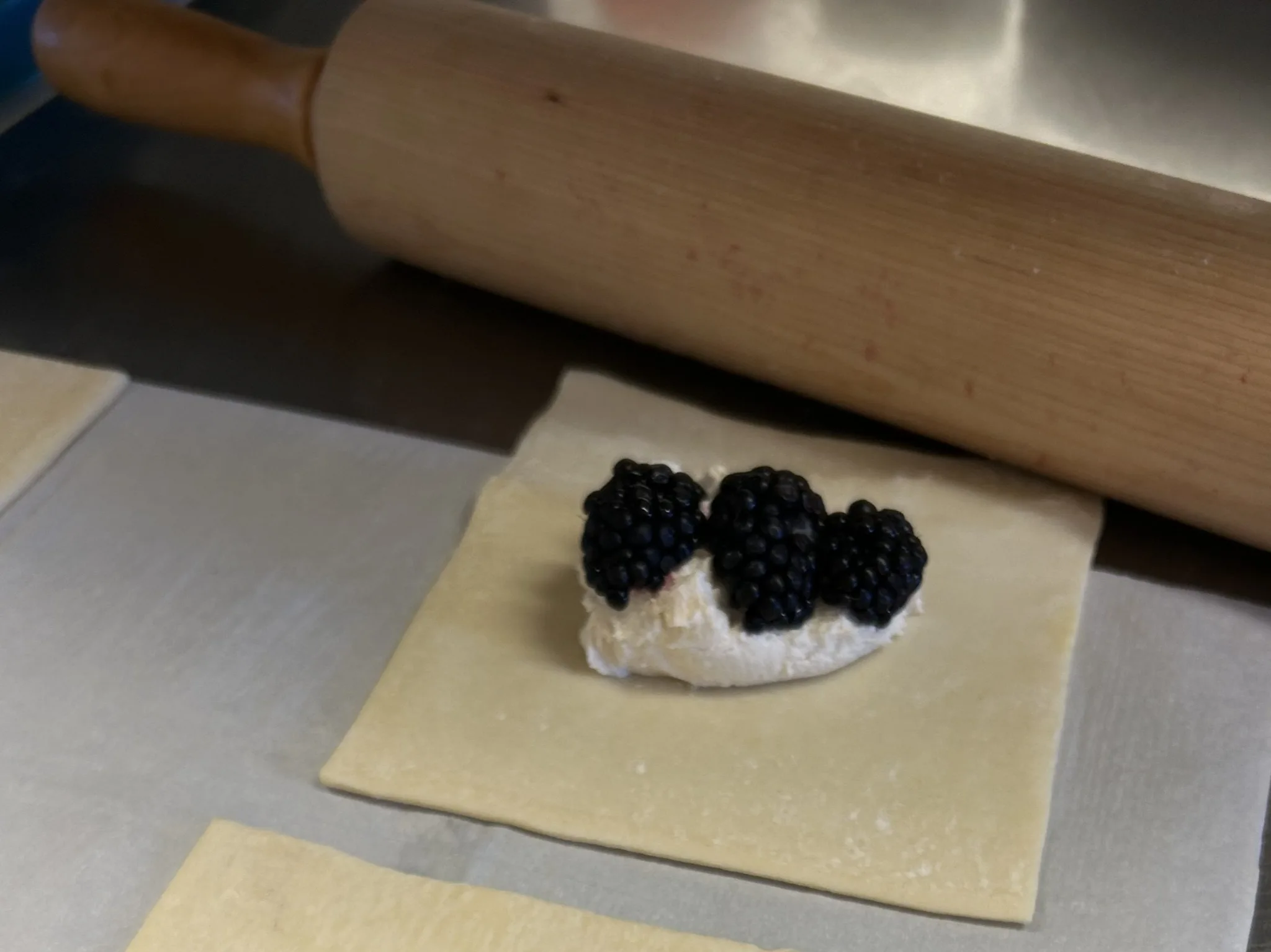 Blackberries and sweet cheese filling placed on pastry squares before folding into hand pies at Kat’s Café & Restaurant.