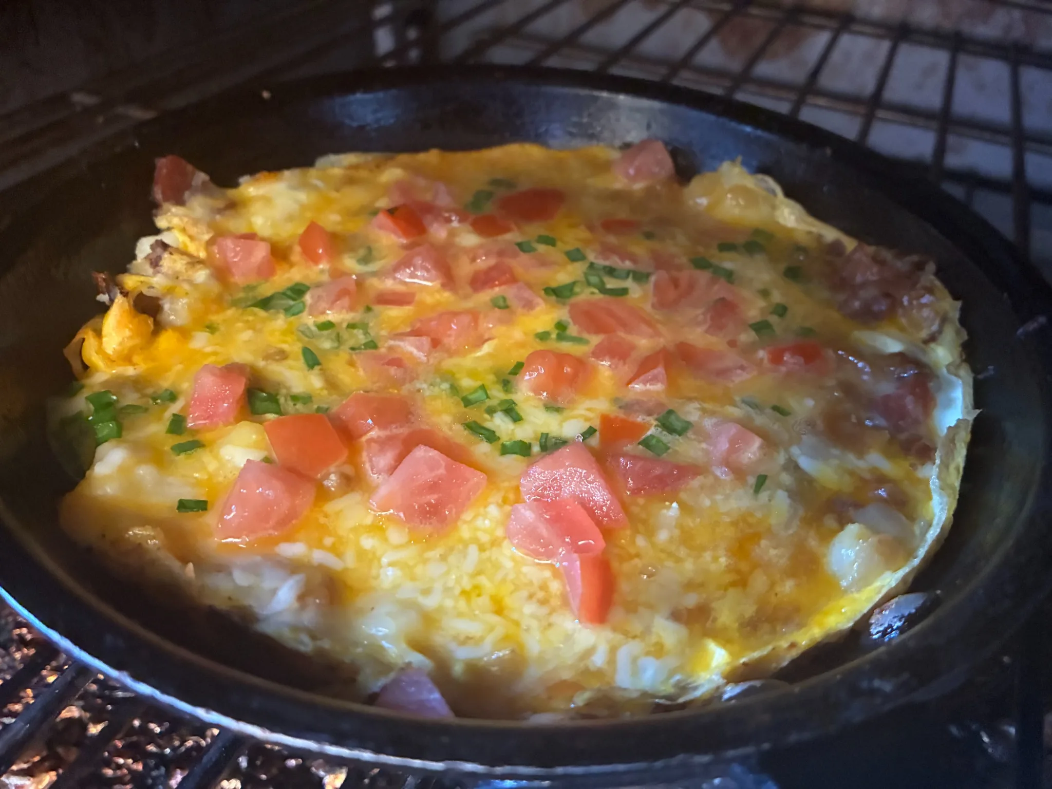 A skillet brunch special with eggs, cheese, tomatoes, and herbs baking in the oven at Kat’s Café & Restaurant.