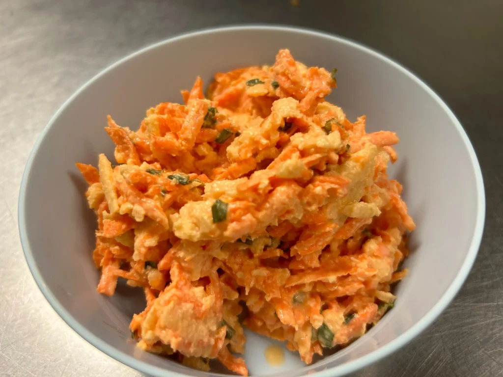 Bowl of shredded carrot apple salad at Kat’s Café & Restaurant.