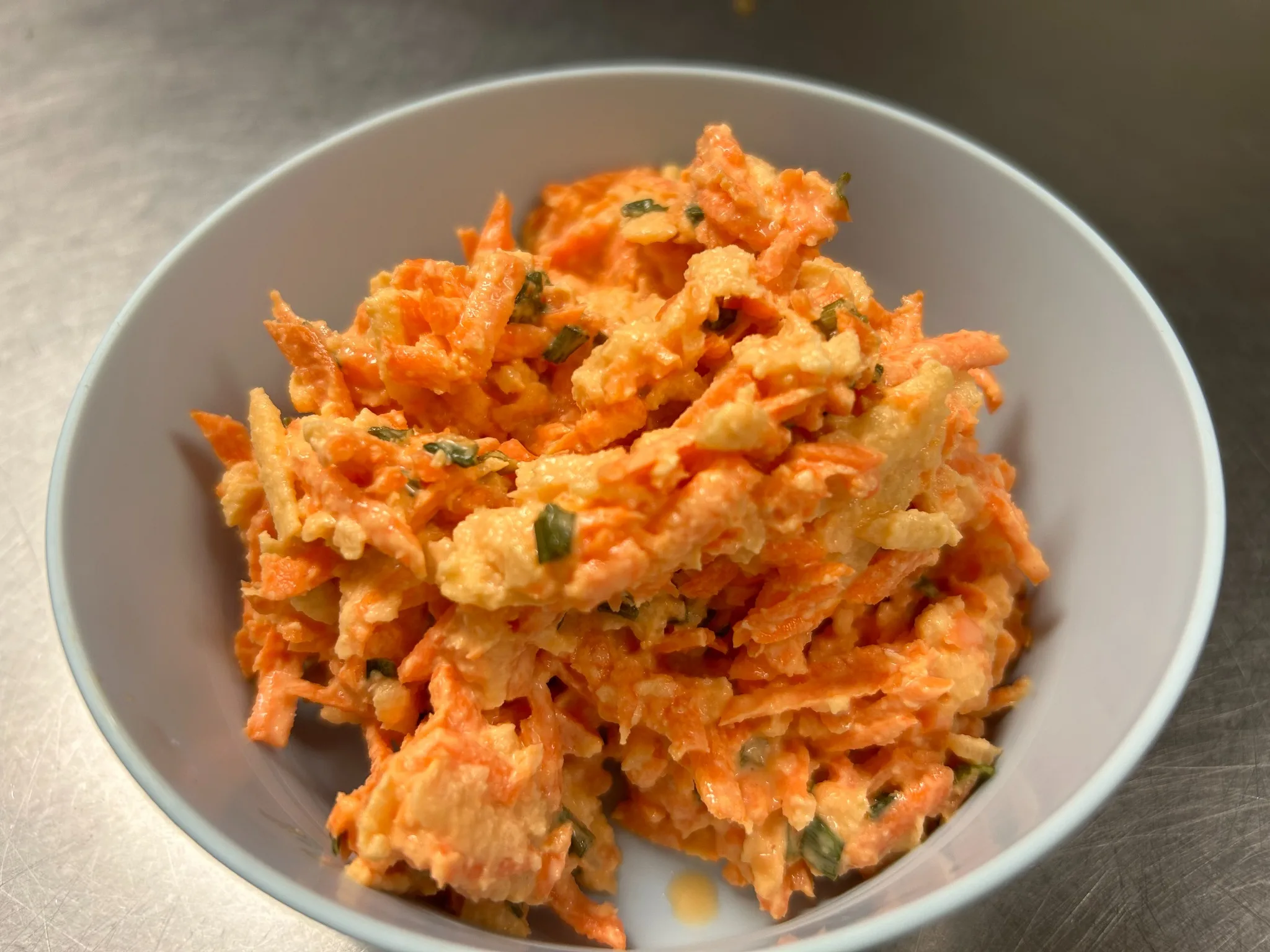 Bowl of shredded carrot apple salad at Kat’s Café & Restaurant.