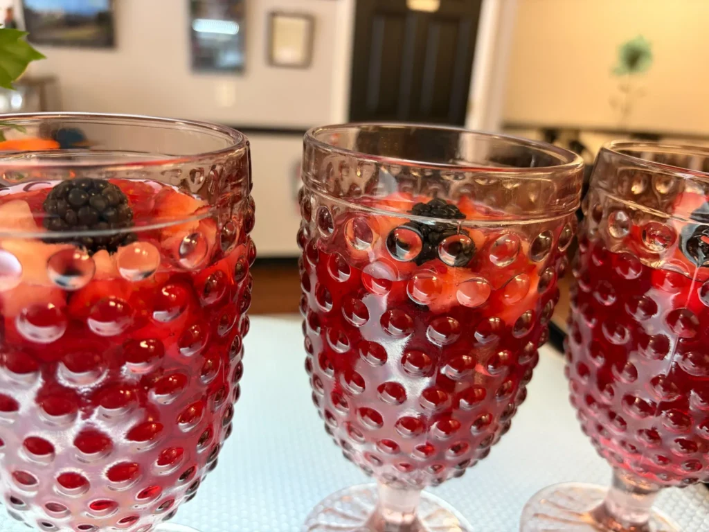 Three stemmed glasses of chilled berry dessert with strawberries and blackberries at Kat’s Café & Restaurant.