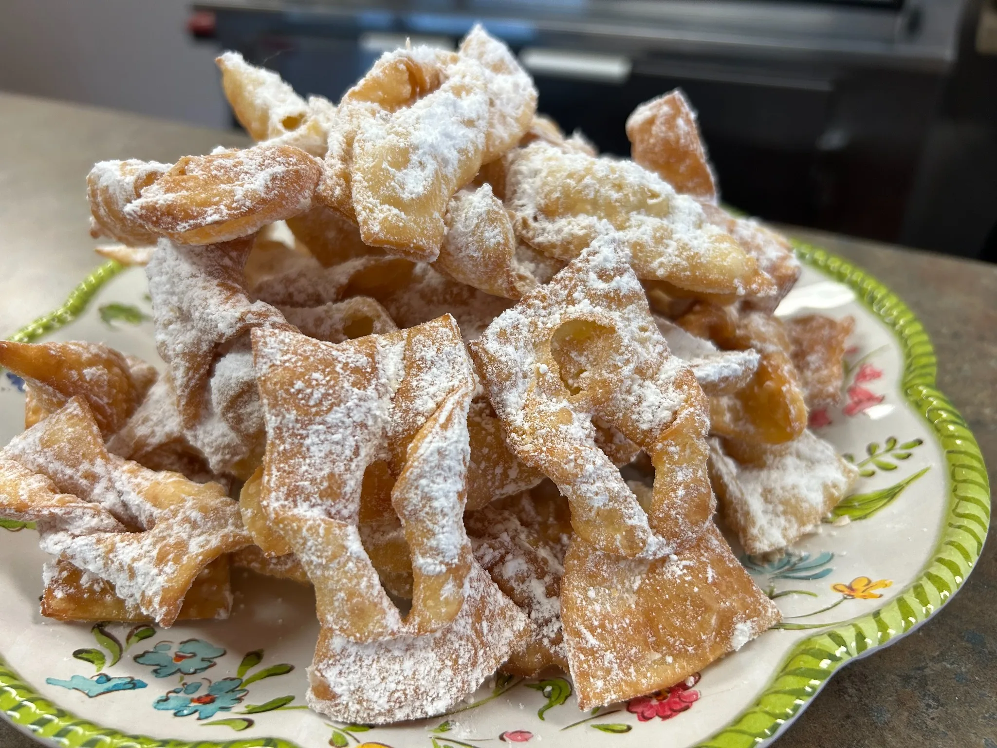 Plate of chruściki angel wing pastries dusted with powdered sugar at Kat’s Café & Restaurant.