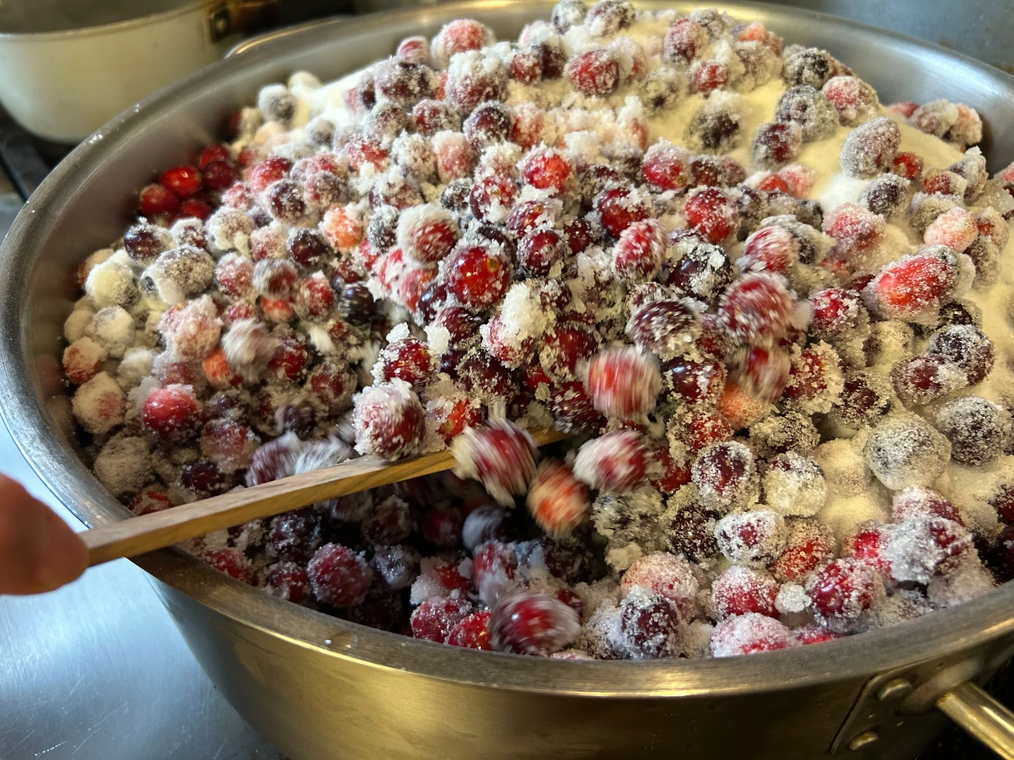Fresh cranberries being mixed with sugar for homemade cranberry sauce at Kat’s Café & Restaurant.