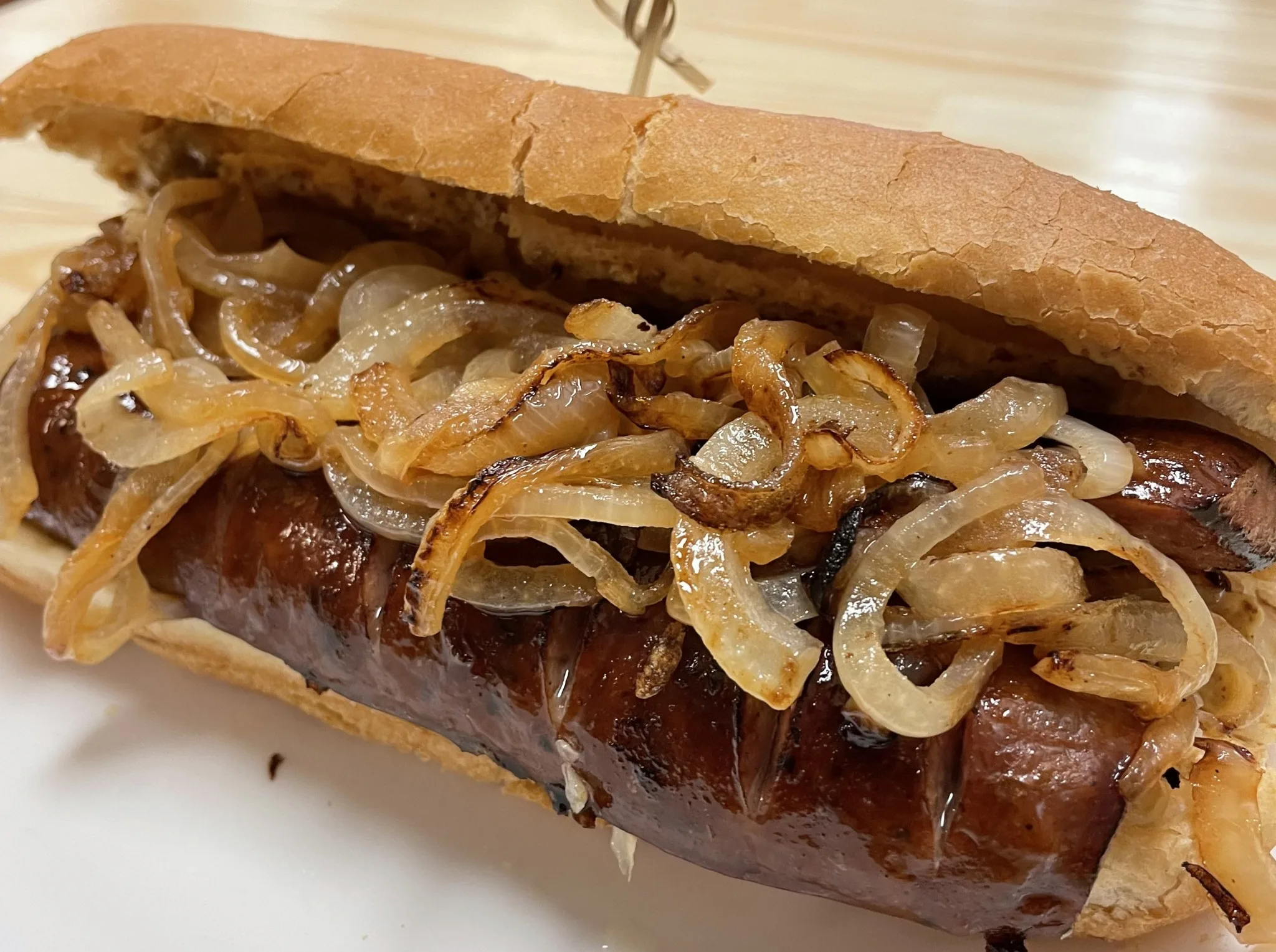 Grilled kielbasa in a long hoagie roll topped generously with sautéed onions at Kat’s Café & Restaurant.