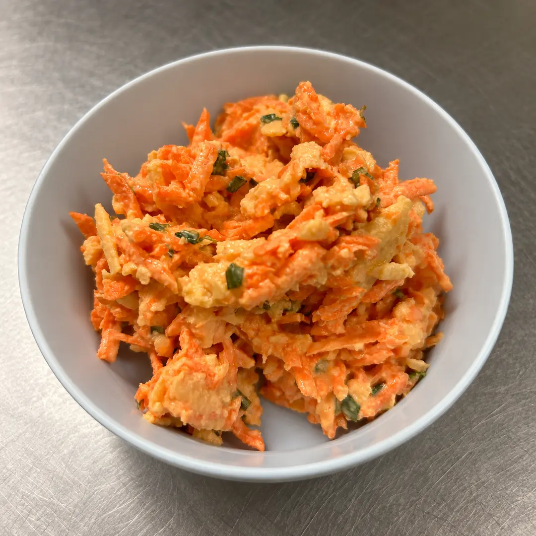 Carrot & Apple Side Salad with shredded carrots, crisp apples, fresh herbs, and creamy house-made dressing at Kat’s Café & Restaurant.