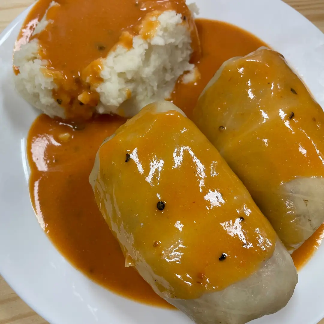 Two house-made halupki cabbage rolls at Kat’s Café & Restaurant, covered in house-made tomato sauce and served with mashed potatoes.