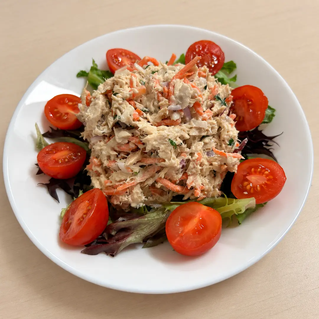 Tuna Salad at Kat’s Café & Restaurant with house-made tuna salad having thinly shaved vegetables, fresh mixed greens, and ripe tomatoes.